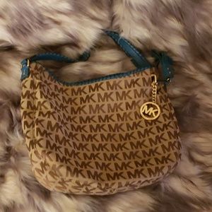 MK bag with teal blue shoulder strap